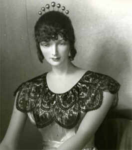 Mannequin wearing lace headpiece and collar